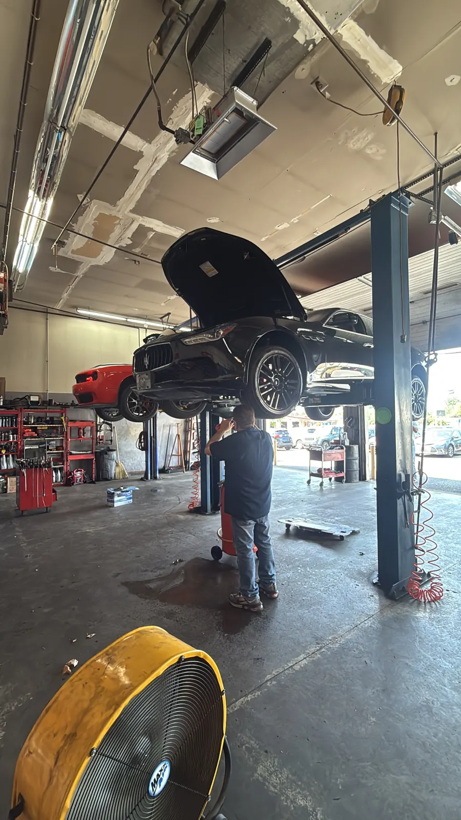 Vehicle raised for under-vehicle service at Hazim Auto Service